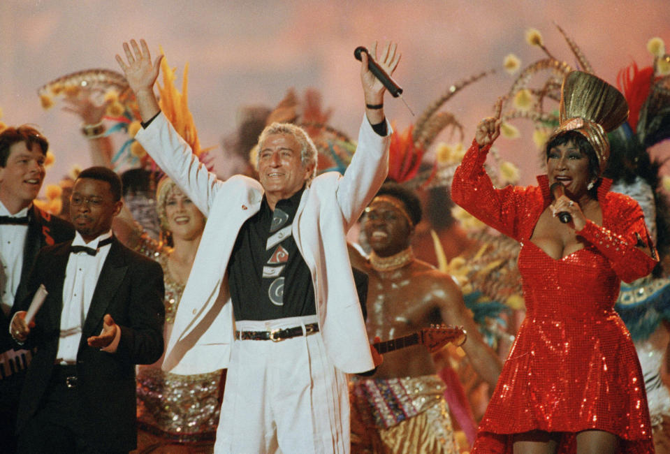 FILE - In this Jan. 29. 1995 file photo, Singers Tony Bennett and Patti LaBelle entertain the crowd during halftime at Super Bowl XXIX at Miami's Joe Robbie Stadium. Regardless of your musical tastes, it seems the Super Bowl halftime show has gone there. From the sublime (Tony Bennett) to the ridiculous ( Janet Jackson's ``uncovering''), and from Michael Jackson's moonwalks to U2's majestic remembrance of the 911 victims, the halftime presentations have drawn nearly as much attention as the NFL championship game itself.(AP Photo/Hans Deryk, File)