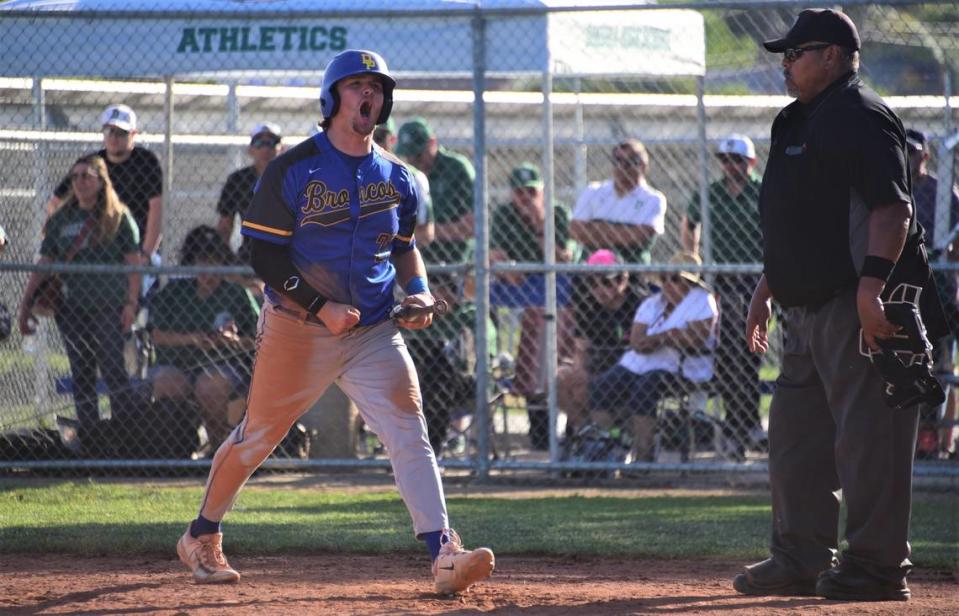 Dos Palos High School senior Will Montemurro reacts after scoring the go-ahead run in the Broncos’ 4-3 victory over Dinuba in the Central Section Division III semifinal game on Tuesday, May 23, 2023 at Dos Palos High School.
