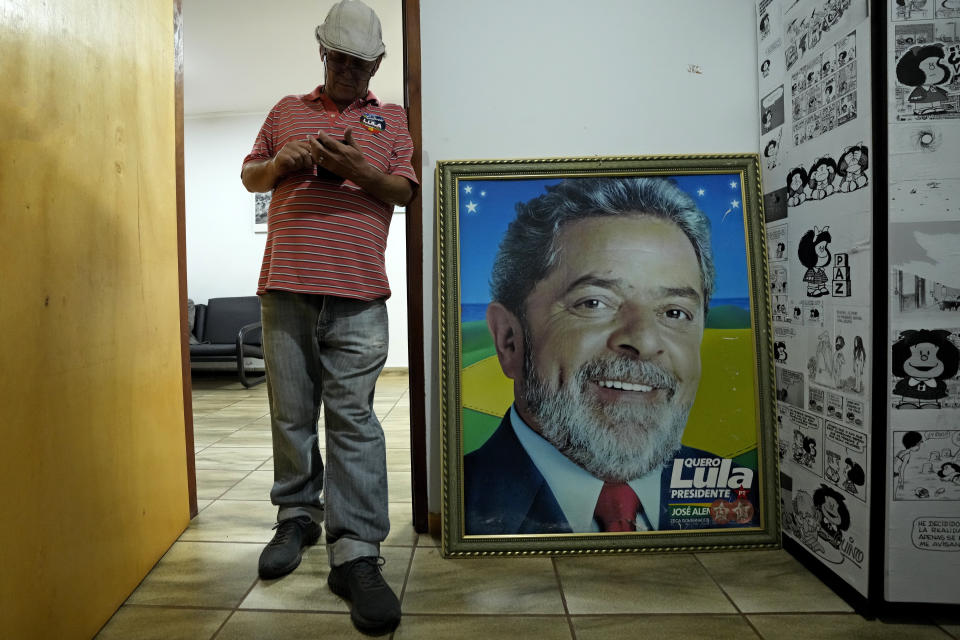 A photo of Brazil's former President Luiz Inacio Lula da Silva stands inside a local campaign headquarters during Da Silva's run for president again in Campo Grande, Mato Grosso do Sul state, Brazil, Friday, Oct. 21, 2022. The presidential run-off election is set for Oct. 30. (AP Photo/Eraldo Peres)