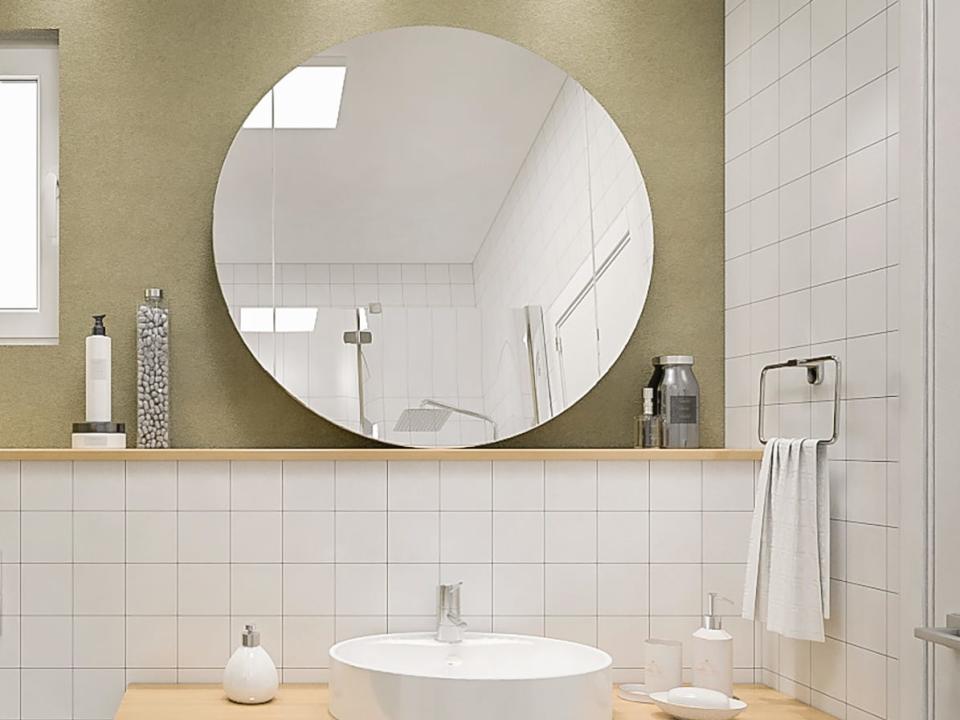 Bathroom with frameless mirror