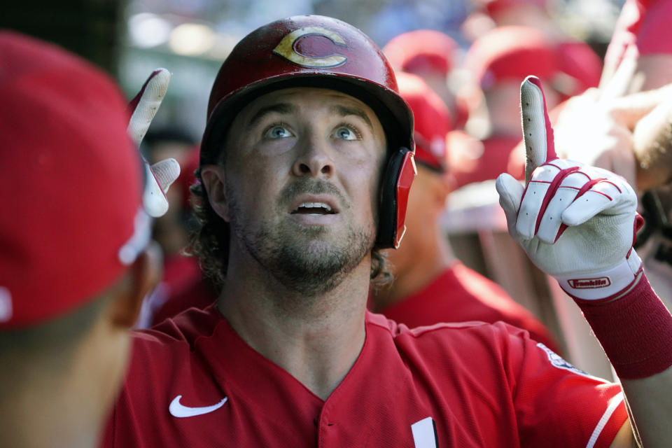 Cincinnati Reds' Kyle Farmer (17) gestures in the dugout after hitting a home run against the Chicago Cubs during the seventh inning of a baseball game, Thursday, Sept. 8, 2022, in Chicago. (AP Photo/David Banks)