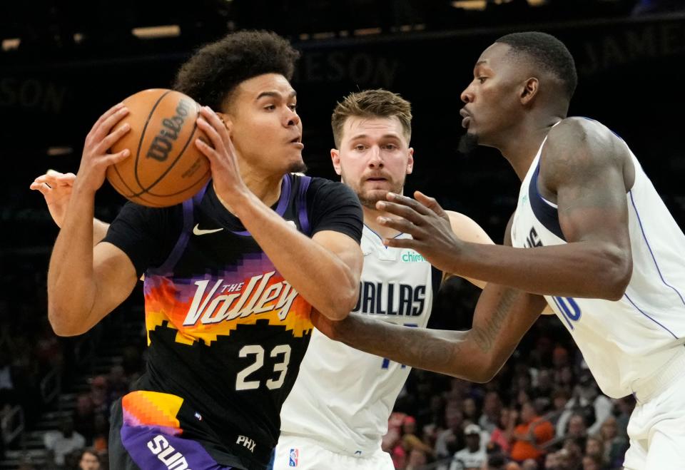 May 15, 2022; Phoenix, Arizona, USA; Phoenix Suns forward Cameron Johnson (23) drives towards Dallas Mavericks forward Dorian Finney-Smith (10) during game seven of the second round for the 2022 NBA playoffs at Footprint Center. Mandatory Credit: Rob Schumacher-Arizona Republic