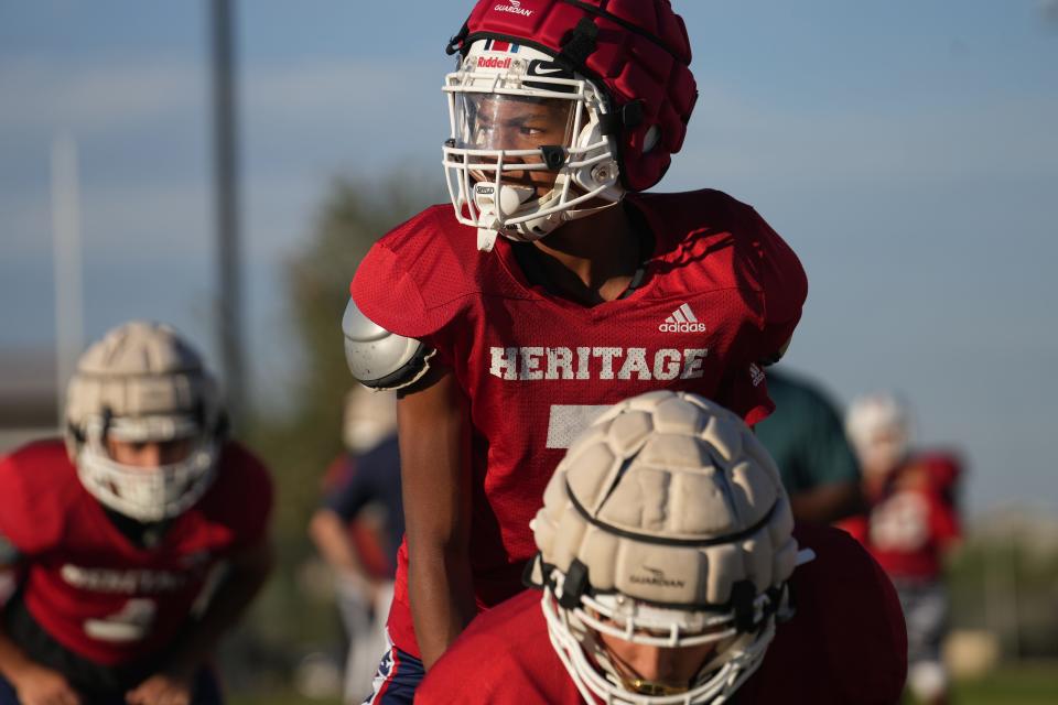 Heritage Academy quarterback Kaleb 'Bubba' Burras prepares to hike the ball during practice in Laveen, Ariz. on Wednesday, Oct. 26, 2022.