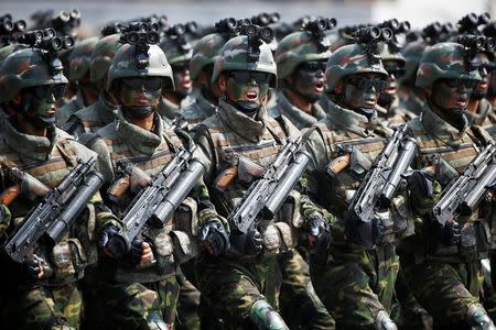 North Korean special forces soldiers march and shout slogans during a military parade marking the 105th birth anniversary of country's founding father, Kim Il Sung in Pyongyang, North Korea April 15, 2017. REUTERS/Damir Sagolj