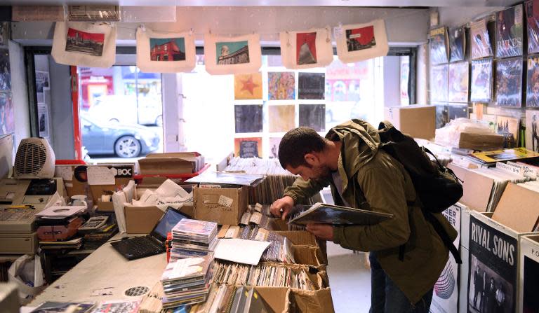 A customer peruses vinyl for sale in the music shop 'Record Collector' ahead of Record Store Day in Sheffield, England on April 17, 2015