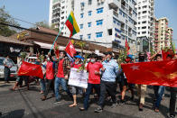 Protesters march in the streets of Yangon, Myanmar on Sunday, Feb. 7, 2021. Thousands of people rallied against the military takeover in Myanmar's biggest city on Sunday and demanded the release of Aung San Suu Kyi, whose elected government was toppled by the army that also imposed an internet blackout. (AP Photo)