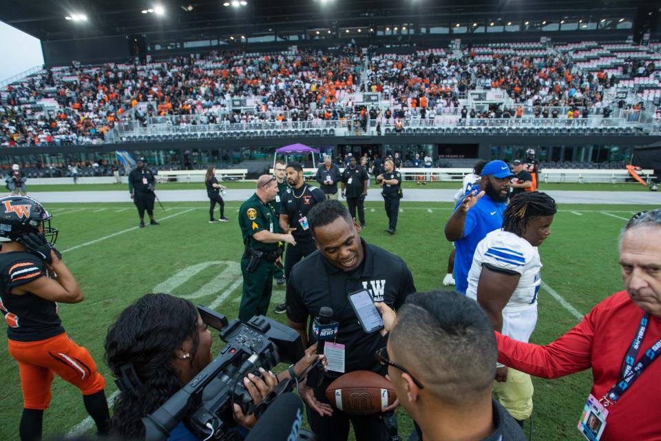 Lake Wales head coach Tavaris Johnson speaks with reporters after the end of the second half of the Class 3S football state championship game between Lake Wales and Mainland at DRV PNK Stadium on Friday, December 16, 2022, in Fort Lauderdale, FL. Final score, Lake Wales, 32, Mainland, 30.