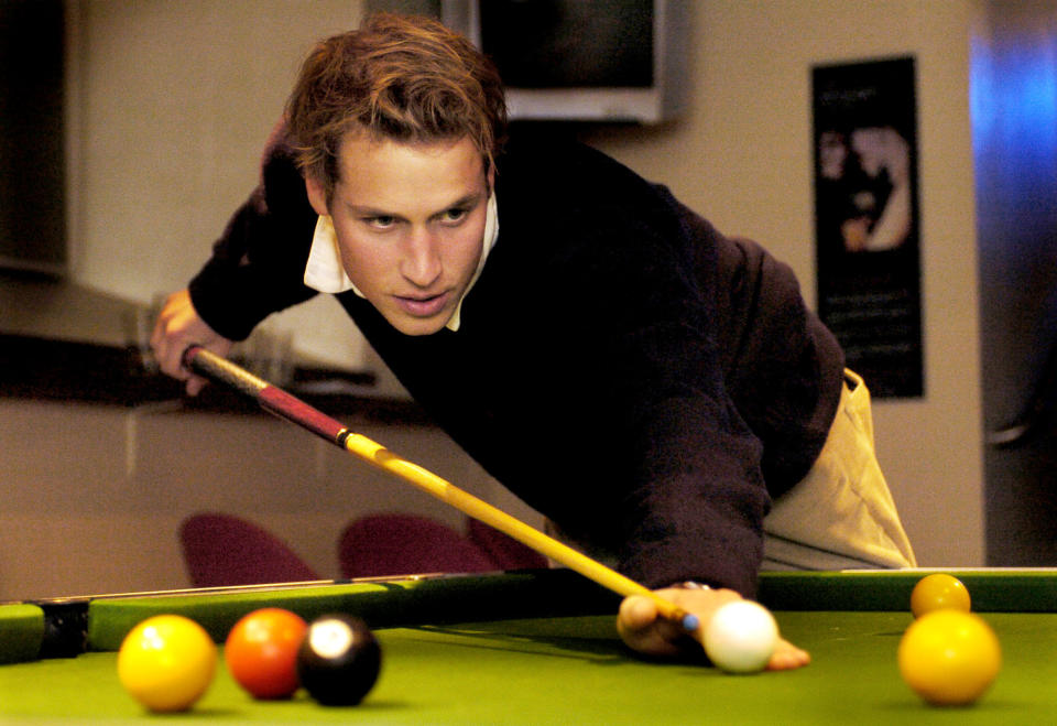 <p>William playing pool with friends at a bar in St Andrews during his final year. He lived with Kate during a lot of his time there. (PA Images)</p> 