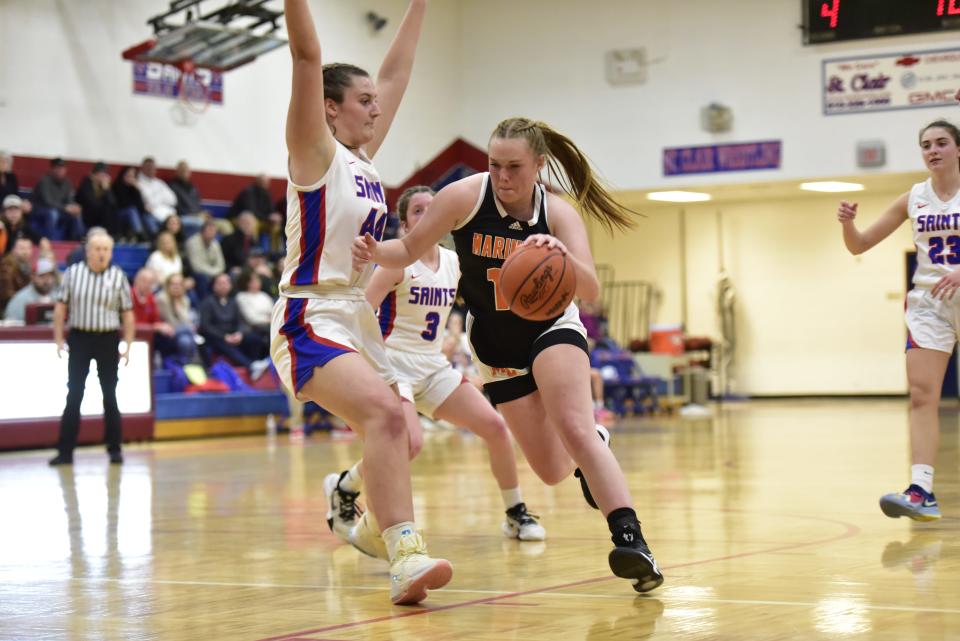 Marine City's Josalyn Dietlin drives the lane during the Mariners' 52-44 loss to St. Clair at St. Clair High School on Friday. She scored a team-high 14 points.