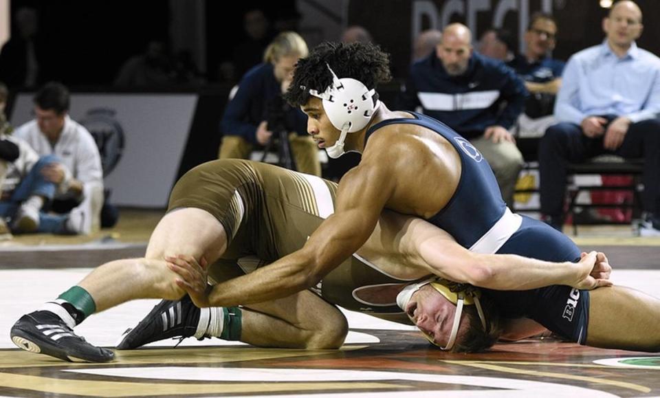 Penn State’s Carter Starocci aims to stop Lehigh’s Jake Logan from scoring in their 174-pound bout in the Nittany Lions’ 24-12 win on Sunday, December 4, 2022. Starocci topped Logan, 22-8.