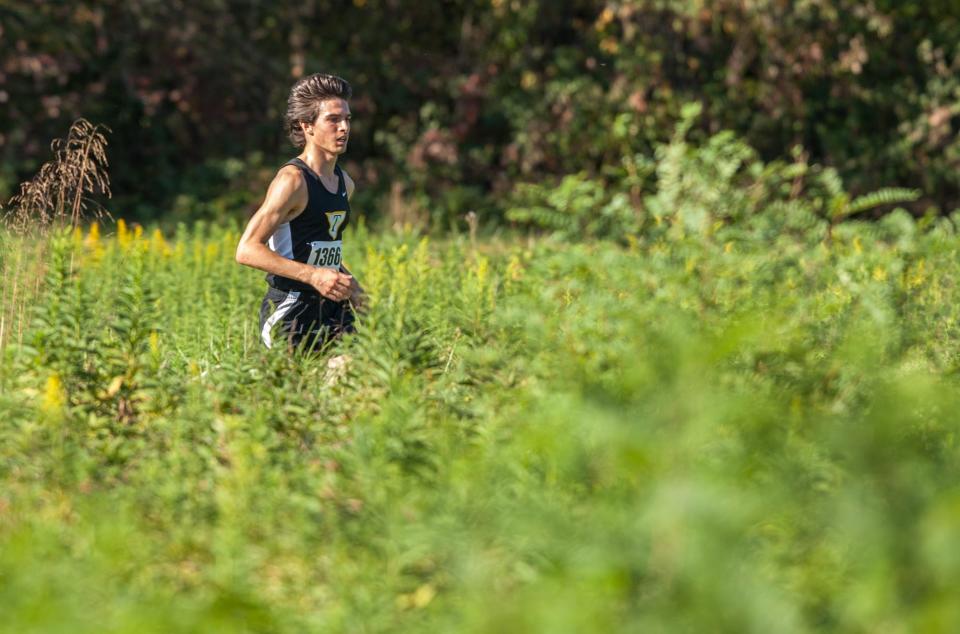 Tatnall's Stephen Garrett races through the final stretch of the Joe O'Neill Invitational at Bellevue State Park on Friday afternoon, October 17, 2014.