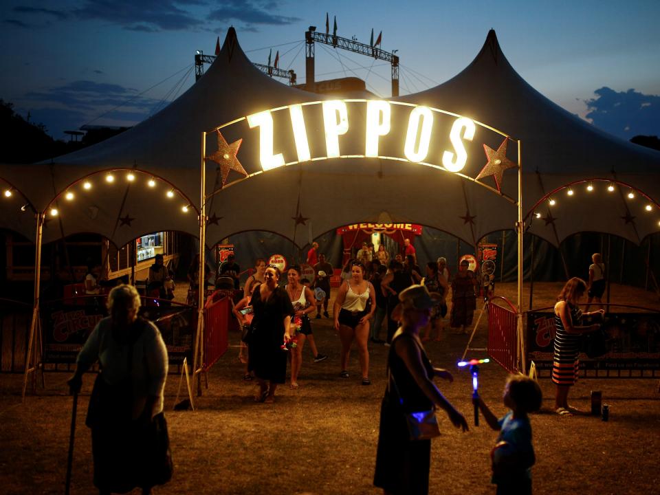 People leave the Zippos Circus after the show called "Rebound!" on its opening night, in Brighton, Britain August 11, 2020. REUTERS/Henry Nicholls