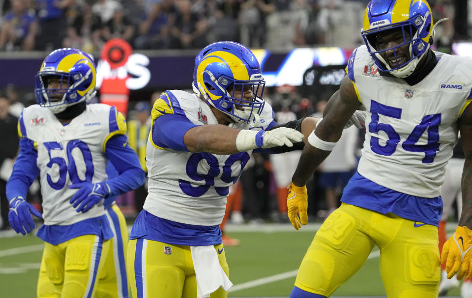 Los Angeles Rams defensive end Aaron Donald (99) and outside linebacker Leonard Floyd (54) react during the first half of the NFL Super Bowl 56 football game against the Cincinnati Bengals Sunday, Feb. 13, 2022, in Inglewood, Calif. (AP Photo/Mark J. Terrill)