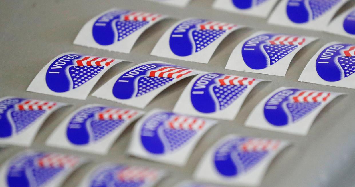 Rows of “I voted” stickers await voters at Bethany Reformed Church poll, Tuesday, November 8, 2022, in Sheboygan, Wis.