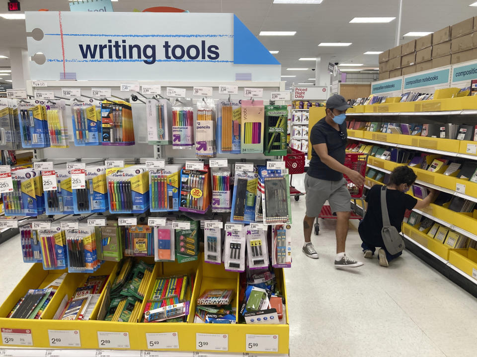 FILE - Shoppers browse deals on school supplies at a Target store in South Miami, Fla., July 27, 2022. (AP Photo/Marta Lavandier, File)