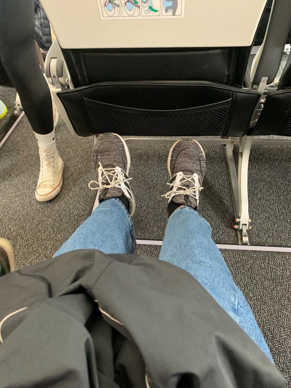 Columnist Laurence Reisman stretches out in the emergency exit row seat of an Airbus A-220 operated by Breeze Airways to Westchester County Airport from Vero Beach Regional Airport Nov. 10, 2023.