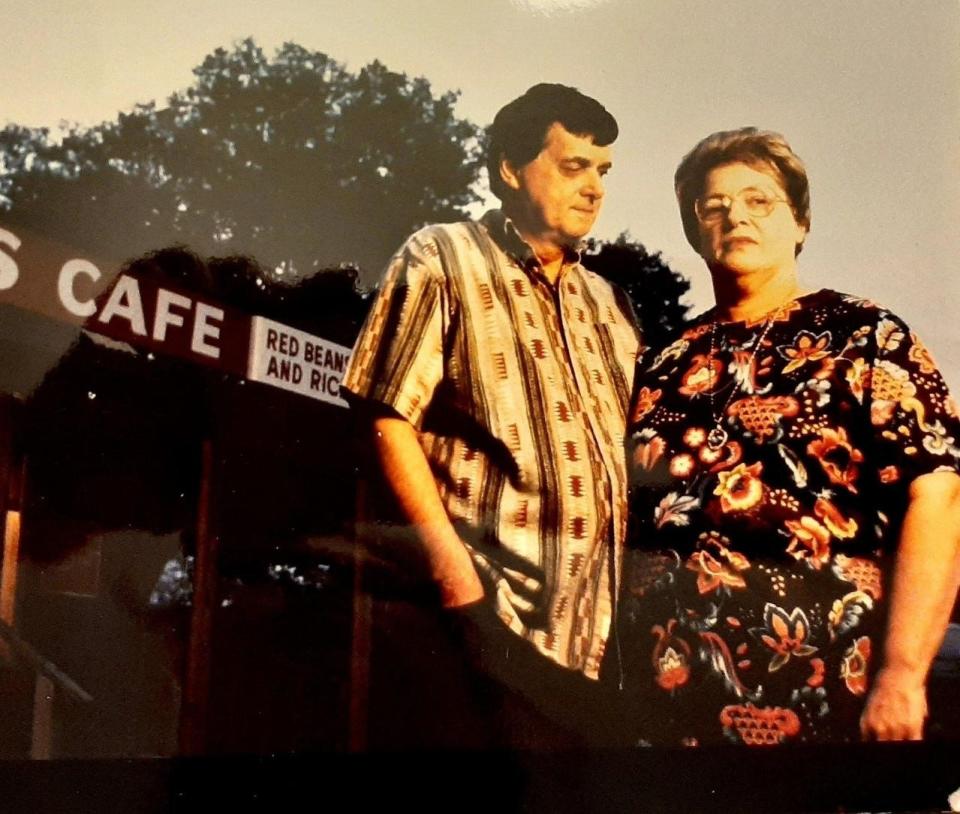 Curly and Jane Hebert pose outside their restaurant, A-Bear's Cafe, which they ran together for decades.