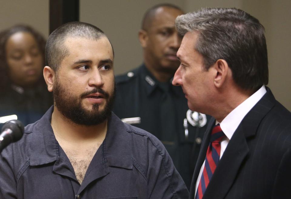 George Zimmerman speaks to defense counsel during a first-appearance hearing in Sanford, Florida