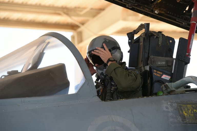 A Saudi pilot sits in a F-15 fighter jet at the Khamis Mushayt military airbase, some 880 km from Riyadh