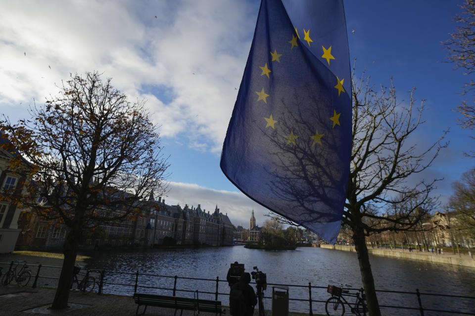 An European Union flag flies outside parliament building, rear left, one day after the far-right Party for Freedom of leader Geert Wilders won the most votes in a general election, in The Hague, Netherlands, Thursday Nov. 23, 2023. (AP Photo/Peter Dejong)