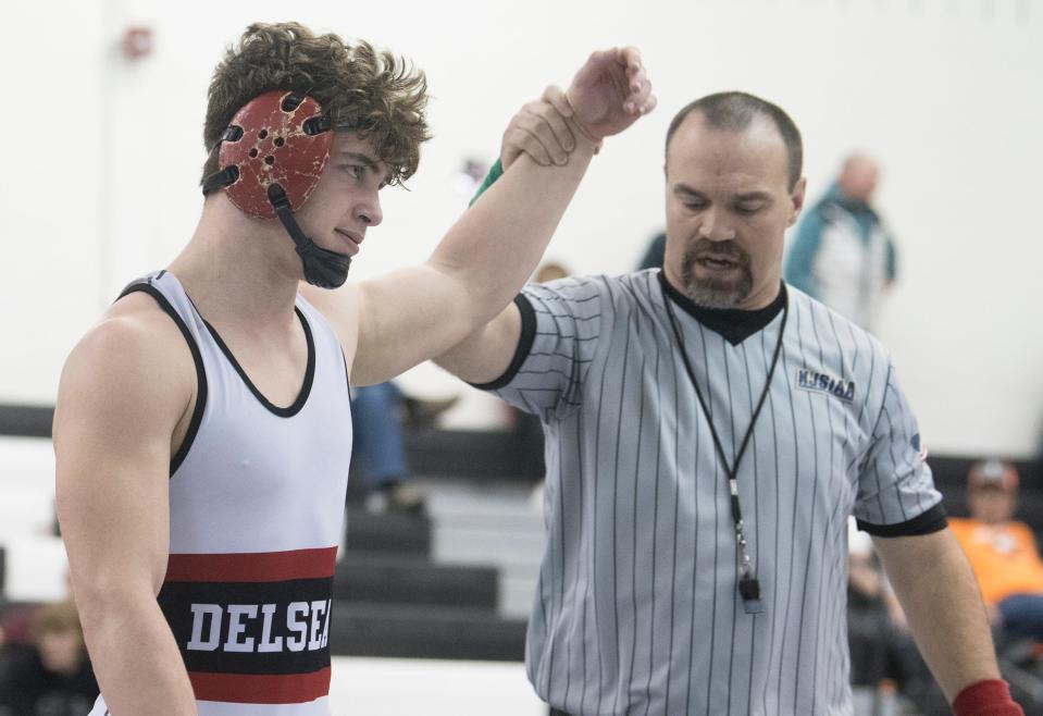 Delsea's Jared Schoppe has his arm raised after defeating Absegami's George Rhodes, 3-2,  in the 175-pound final of the Region 8 wrestling championships at Egg Harbor Township High School, Saturday, Feb. 26, 2022.