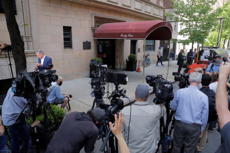 Members of the media are seen outside the apartment building of Former New York City Mayor Rudy Giuliani, personal attorney to U.S. President Donald Trump, in Manhattan, New York City, New York