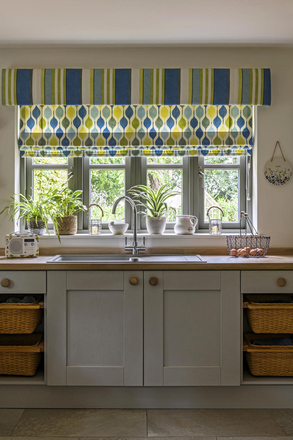 <p> Baskets fitted on sliding rails are a brilliant twist on traditional drawers when you're thinking of country kitchen ideas. As well as providing accessible storage, they’ll enhance the look of your kitchen by adding texture and natural materials to your cabinetry. Complement the look with wooden handles and a timber work surface. </p>