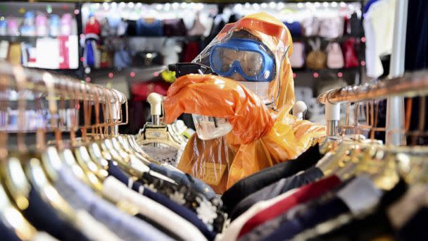 PHOTO: A worker in a protective suit disinfects a store in Pyongyang, North Korea, June 27, 2022. (Kyodo News via Getty Images)