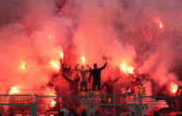 Atletico supporters light bengals prior to the Champions League quarterfinal second leg soccer match between Borussia Dortmund and Atletico Madrid at the Signal-Iduna Park in Dortmund, Germany, Tuesday, April 16, 2024(AP Photo/Martin Meissner)