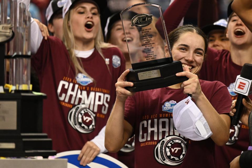 Mar 5, 2023; Greensboro, NC, USA; Virginia Tech Hokies guard Georgia Amoore (5) holds the MVP trophy after the Hokies won the ACC Women's Championship over the Louisville Cardinals at Greensboro Coliseum. Mandatory Credit: William Howard-USA TODAY Sports