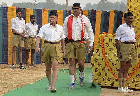 Bhagwat (3rd L), chief of the Hindu nationalist organisation Rashtriya Swayamsevak Sangh (RSS), walks after addressing RSS volunteers during a training camp in Agra, India, in this November 3, 2014 file photo. REUTERS/Brijesh Singh/Files