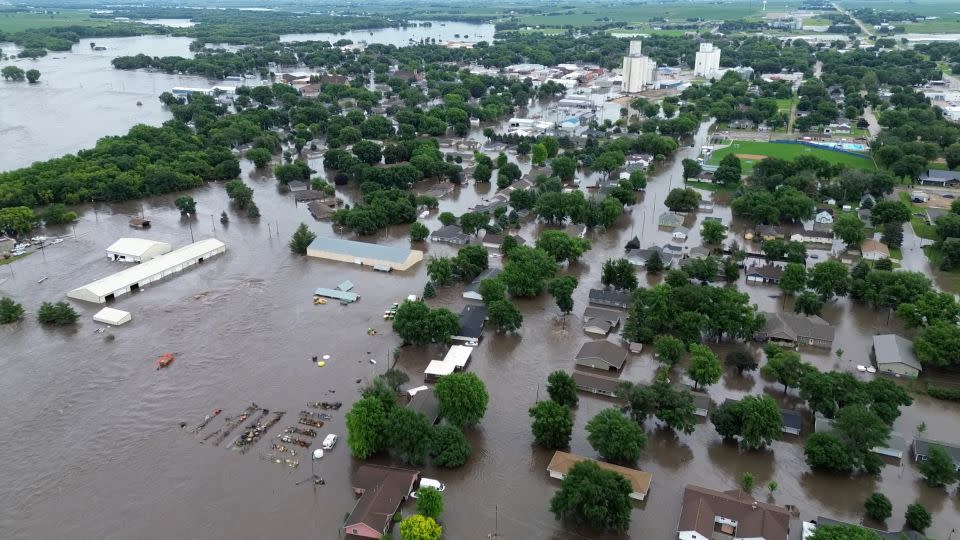 Iowa Gov. Kim Reynolds flew over the flood-ravaged state Saturday with federal officials. Reynolds said she is working with federal agencies on recovery efforts. - Chris VB/UGC/Reuters