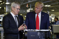 President Donald Trump tours an Apple manufacturing plant, Wednesday, Nov. 20, 2019, in Austin with Apple CEO Tim Cook. (AP Photo/ Evan Vucci)