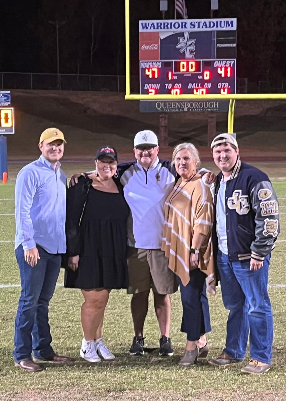 JB Arnold poses with his wife Stacy and children Bryant, Raley and Burton following his final home game at Jefferson County High School's Warrior stadium.