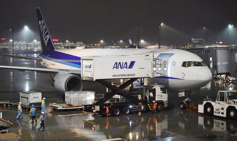 A charter plane bound for Wuhan, China, which is to evacuate Japanese nationals from the Chinese city, is seen at Haneda airport in Tokyo