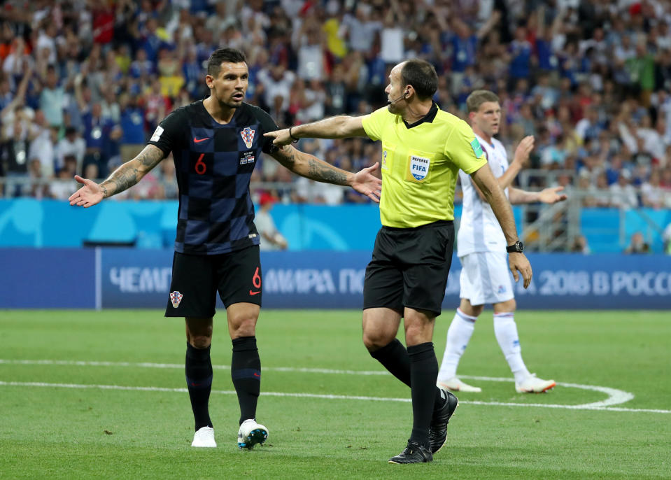 <p>Referee Antonio Mateu Lahoz awards a penalty to Iceland despite Dejan Lovren’s appeals </p>