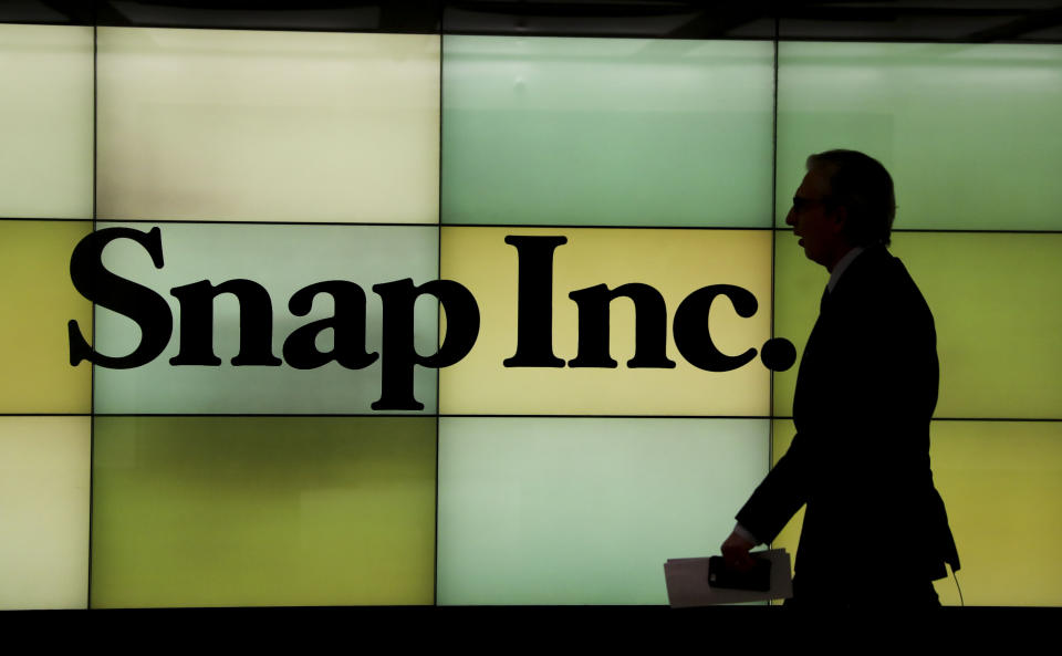 New York, March 2, 2017 : A man walks past the logo of Snap Inc. at New York Stock Exchange in New York, the United States on March 2, 2017. Snap made its trading debut on the New York Stock Exchange on Thursday, in the largest technology initial public offering since Alibaba. (Xinhua/ Wang Ying via Getty Images)