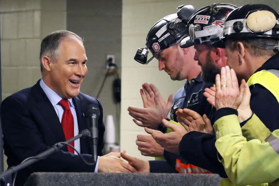 EPA's Scott Pruitt, left, shakes hands with coal miners.