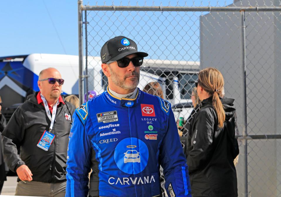 Two-time Daytona 500 Champion Jimmie Johnson walks through the garages to attend the drivers meeting before the Daytona 500, Monday, Feb. 19, 2024 at Daytona International Speedway.