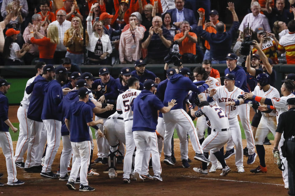 Houston Astros celebrate after winning Game 6 of baseball's American League Championship Series against the New York Yankees Saturday, Oct. 19, 2019, in Houston. The Astros won 6-4 to win the series 4-2. (AP Photo/Sue Ogrocki)