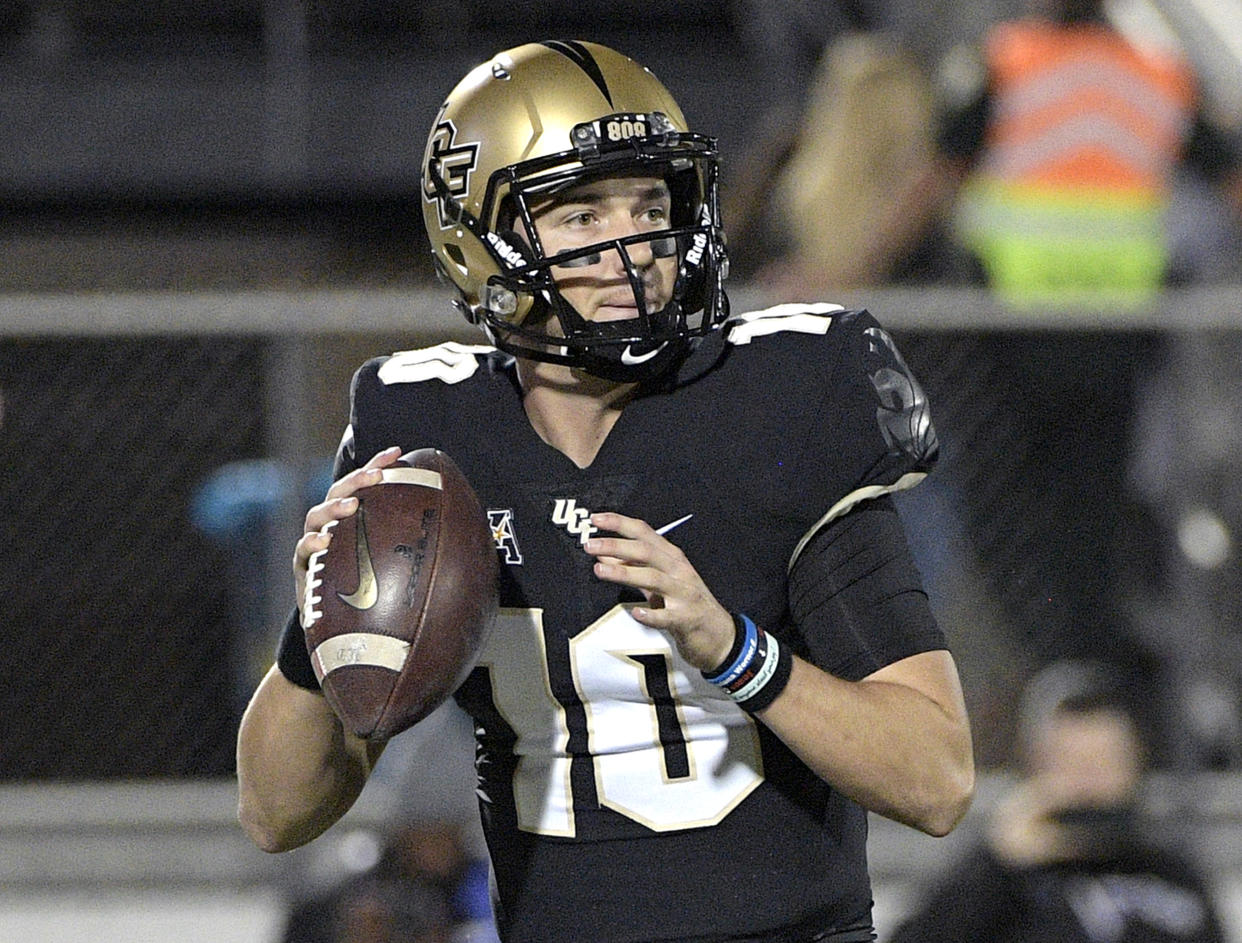 Central Florida quarterback McKenzie Milton (10) suffered a nasty knee injury against South Florida. (AP Photo/Phelan M. Ebenhack)