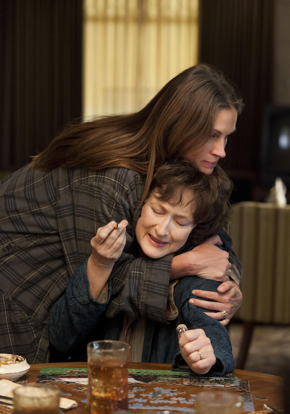 This publicity image released by The Weinstein Company shows, from left, Julia Roberts and Meryl Streep in a scene from "August: Osage County." The film is nominated for a Writers Guild Award for adapted screenplay announced on Friday, Jan. 3, 2013. The Writers Guild Award winners will be honored on Feb. 1, 2014, simultaneous in Los Angeles and New York. (AP Photo/The Weinstein Company, Claire Folger)