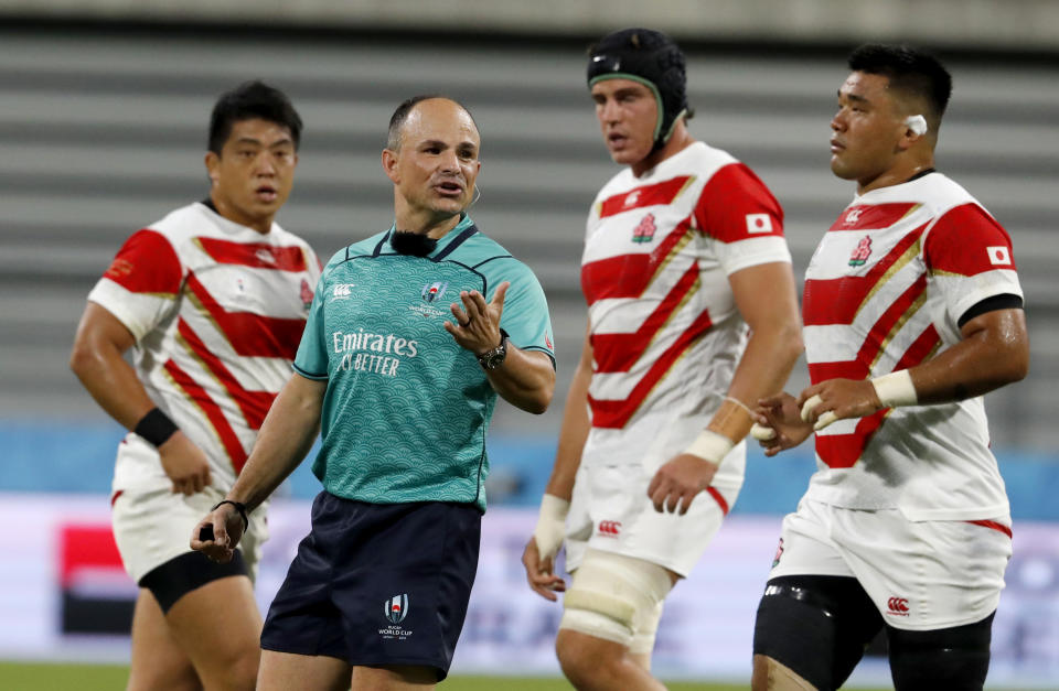 Referee Jaco Peyper talks to the players during the Rugby World Cup Pool A game at City of Toyota Stadium between Japan and Samoa in Tokyo City, Japan, Saturday, Oct. 5, 2019. (AP Photo/Shuji Kajiyama)