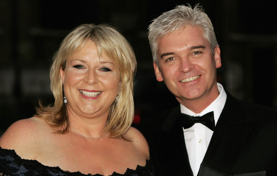 Phillip Schofield and Fern Britton arrive at ITV's 50th Anniversary Royal Reception at the Guildhall on October 13, 2005 in London, England. Queen Elizabeth II and Prince Philip, Duke of Edinburgh attended the reception and dinner celebrating 50 years of the UK's first independent television station at the venue from which the first programme on September 22, 1955, came live.  (Photo by Gareth Cattermole/Getty Images)