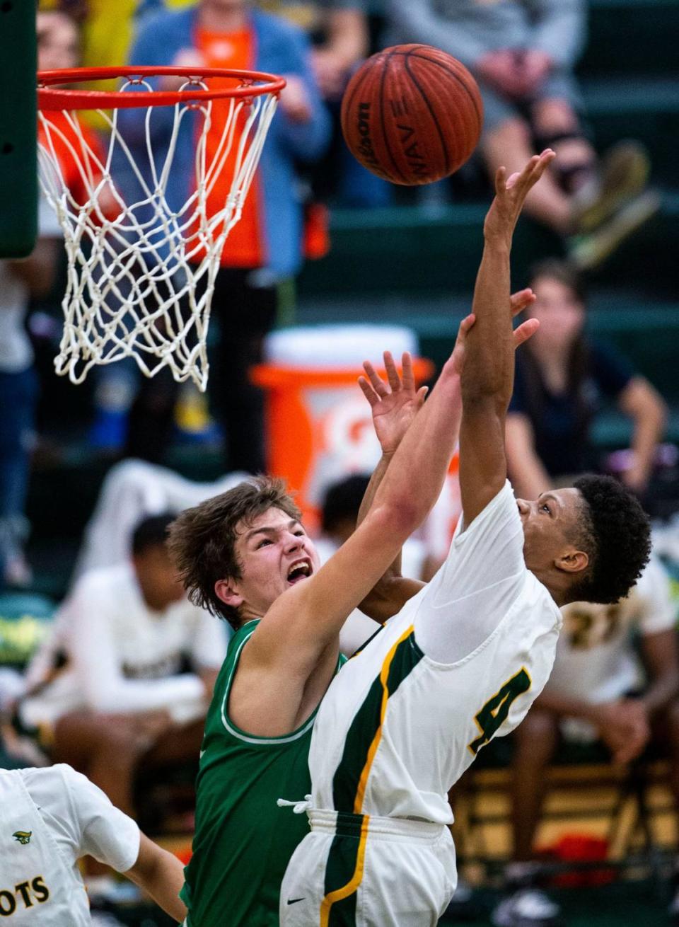 Myers Park’s Drake Maye, left, blocks the shot of Independence’s Tachai Miller during a game at Independence High School in Charlotte, NC on Friday, January 17, 2020. Joshua Komer/The Charlotte Observer