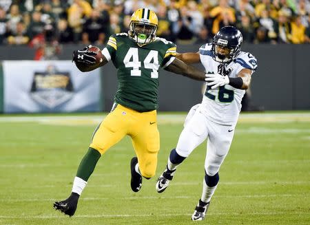 Green Bay Packers running back James Starks (44) gets past Seattle Seahawks defensive back Cary Williams (26) for extra yards in the third quarter at Lambeau Field. Sep 20, 2015; Green Bay, WI, USA. Benny Sieu-USA TODAY Sports