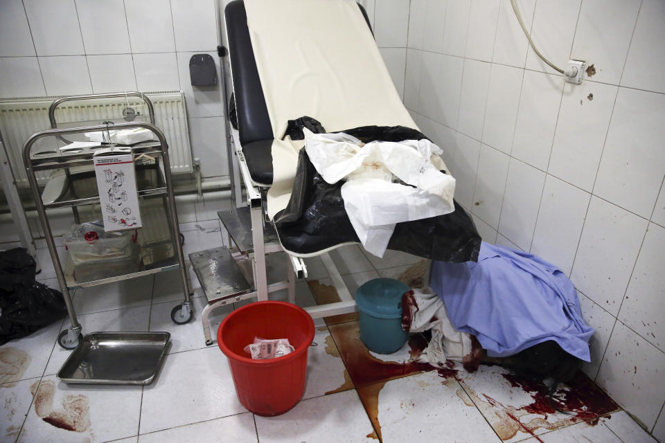 Body of a woman killed during an attack lie on the ground at a delivery room of a maternity hospital in Kabul, Afghanistan, Tuesday, May 12, 2020. Militants stormed a maternity hospital in the western part of Kabul on Tuesday, setting off an hours-long shootout with the police and killing over a dozen people, including two newborn babies, their mothers and an unspecified number of nurses (AP Photo/Rahmat Gul)