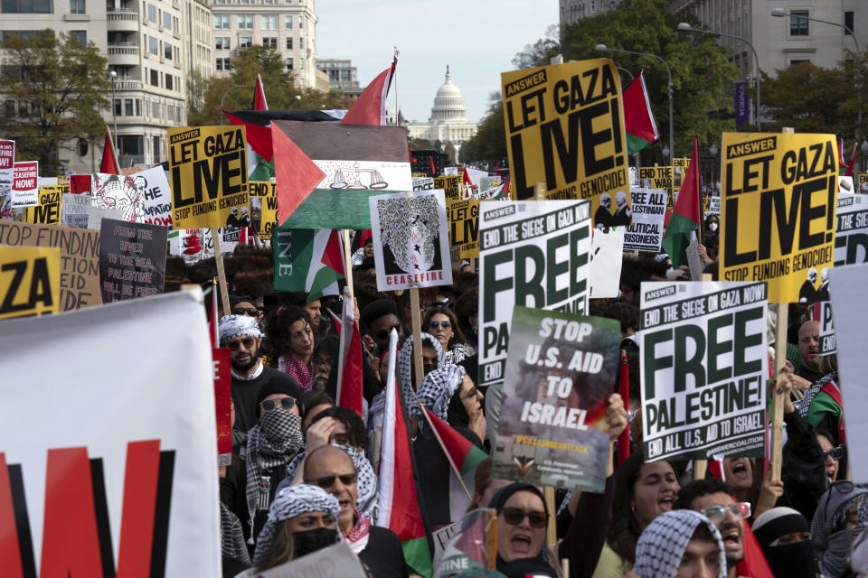 With the U.S. Capitol n the background thousands of anti-war activists rally during a pro-Palestinian demonstration asking to cease fire in Gaza, at Freedom Plaza in Washington, Saturday, Nov. 4, 2023. (AP Photo/Jose Luis Magana)