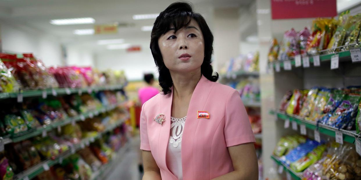 Song Un Pyol, manager at the upscale Potonggang department store in Pyongyang, North Korea, stands in the snacks aisle while being interviewed by The Associated Press on June 19, 2017. Three generations into the ruling dynasty begun by Kim Il Sung, markets have blossomed and a consumer culture is taking root.