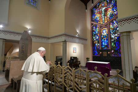 Pope Francis prays during a meeting with representatives of other Christian denominations at Saint Peter's Cathedral in Rabat, Morocco, March 31, 2019. Vatican Media/­Handout via REUTERS